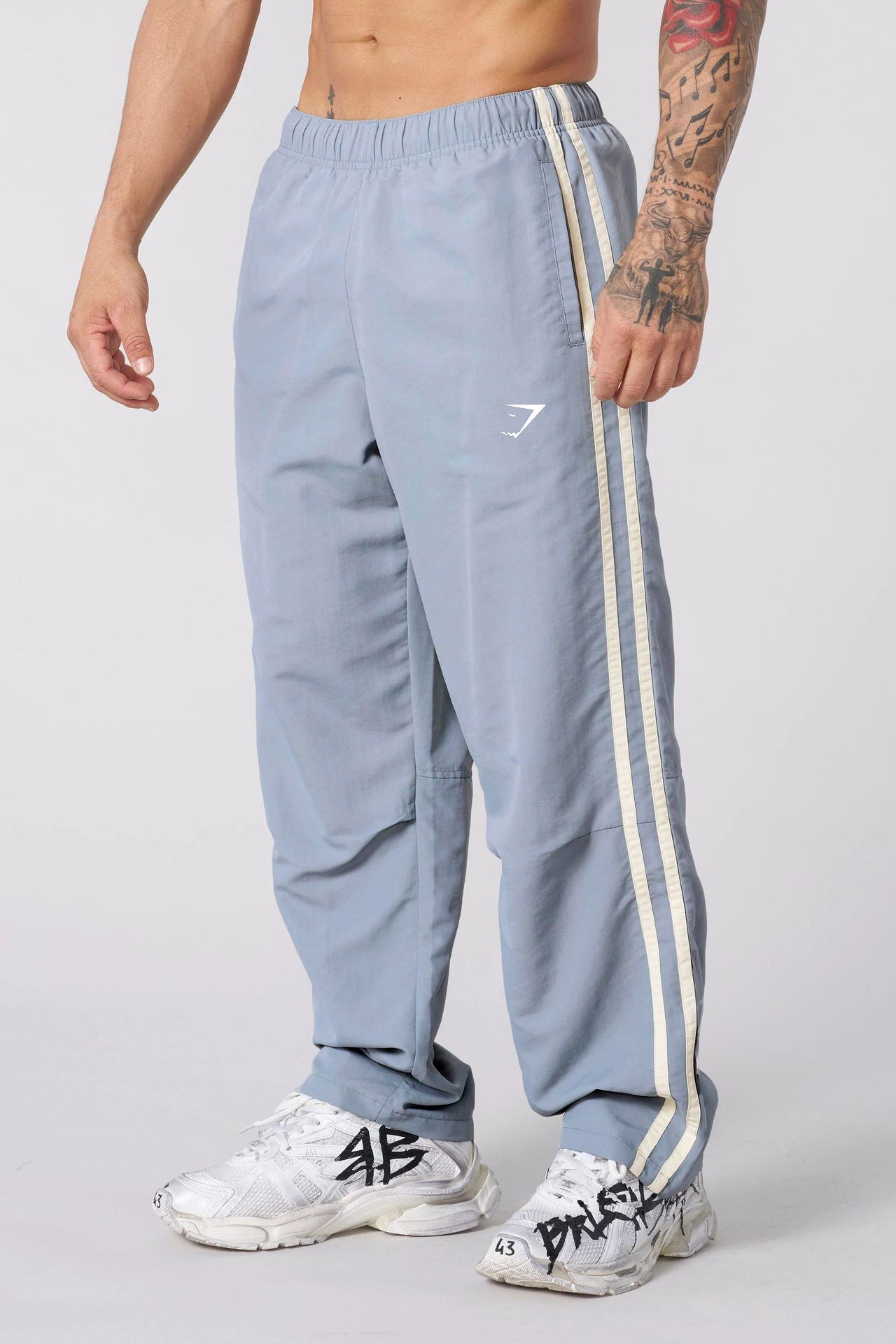 Gymshark Light Blue Track Pants with Cream Side Stripes